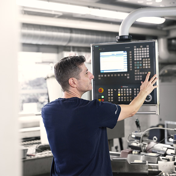 Employee working on big maschine